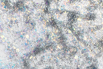 Texture of silver glitter as background, closeup