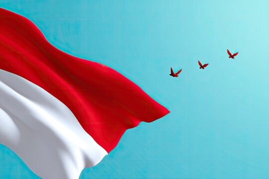 Indonesian flag waves near three birds against a cyan sky