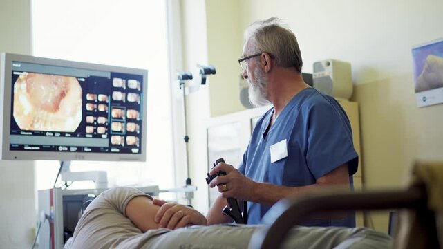 Gastroscopy procedure on sedated patient to examine upper digestive tract.