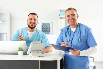 Male medical interns at reception in clinic
