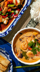 Savory Thai banquet with velvety tom kha gai, piquant vibrant stir-fry, Songkran festival flavors...