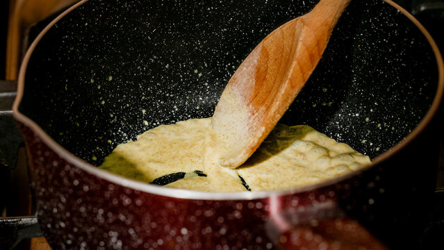Mystical roux simmers in a galaxy-speckled pot, hinting at savory alchemy; celebrate International Sauce Day and Kitchen Witchery