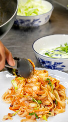 Tangled noodles drenched in zesty kimchi, Asian fusion delight, Lunar New Year feast, spicy umami dance, culinary artistry