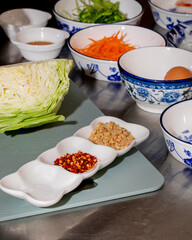 Elegant culinary symphony with vibrant spices and tender cabbage, evoking Lunar New Year preparations and Umami Day celebration