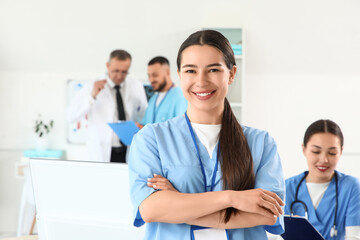 Portrait of female medical intern in clinic