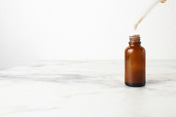 ointment medicine in a brown bottle on a white background space for text copyspace