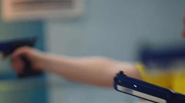Shooting practice with electronic training pistols at a local range
