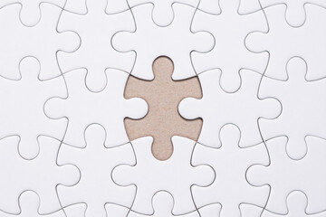 Missed part. Conceptual photo. Puzzle solving. Close up last piece in place in a jigsaw puzzle....
