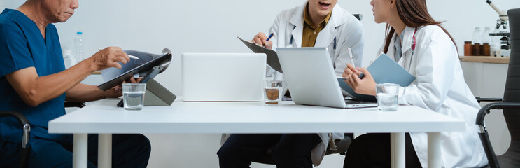 Medical, meeting and laptop for team in office in discussion, brainstorming and planning. Doctor,...