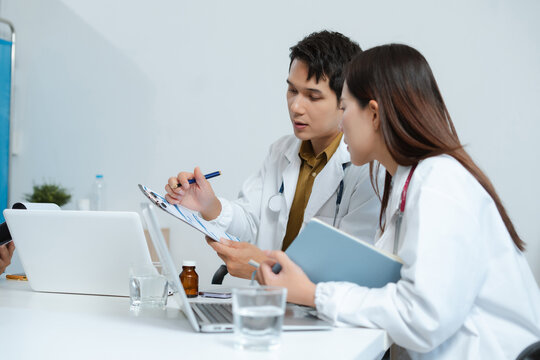 Medical, meeting and laptop for team in office in discussion, brainstorming and planning. Doctor, nurse and computer on desk, teamwork or workshop for data analytics.