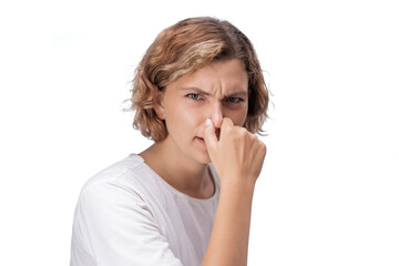 Caucasian Woman Holding Nose In Disgust From Foul Odor Or Bad Hygiene