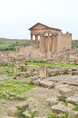 View of the Temple of Saturn in Dougga Tunisia with Roman Columns and Open Landscape in the Background