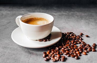Coffee cup and coffee beans on gray background,  Espresso coffee cup aromatic