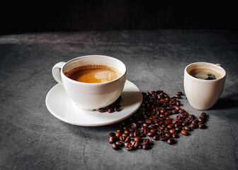 Espresso coffee cup with Americano coffee shot and roasted coffee beans on gray background