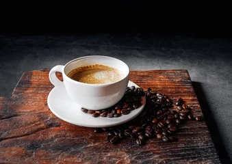  Coffee cup and coffee beans on gray background,  Espresso coffee cup aromatic on a wooden tray © NARONG