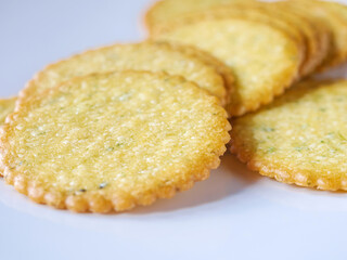 Thin round biscuits crackers stacked together close-up, Sweet and tasty round butter crackers.