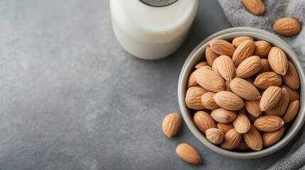 An aesthetically pleasing bowl of almonds paired with a glass of milk, illustrating simplicity and the nourishing qualities of healthy snacks in everyday life.