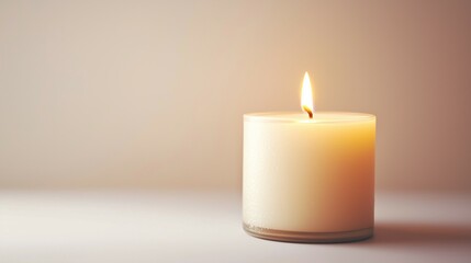 Burning candle in glass jar 