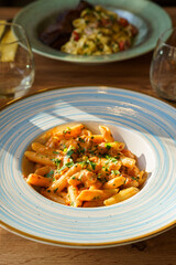 Creamy penne pasta with sausage and herbs