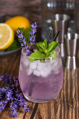 Mojito cocktail with lavender flavor, served with mint and lavender sprigs