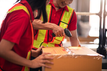Factory worker,Shipping Team in Distribution Warehouse Packing Products for Delivery with Colleague...