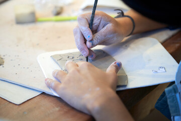 Shape clay with hands