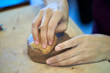 Shape clay with hands