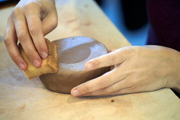 Shape clay with hands
