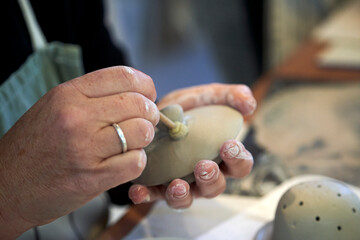 Shape clay with hands