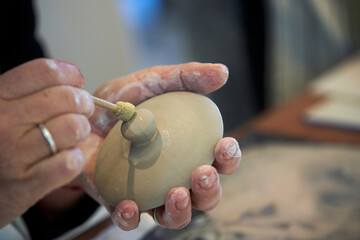 Shape clay with hands