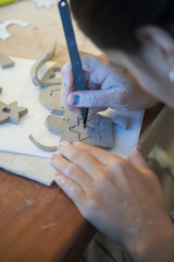 Shape clay with hands