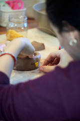 Shape clay with hands