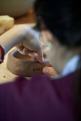 Shape clay with hands