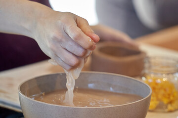 Shape clay with hands