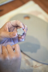 Shape clay with hands