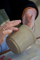 Shape clay with hands