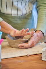 Shape clay with hands