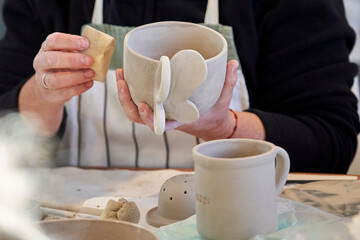 Shape clay with hands