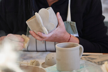 Shape clay with hands