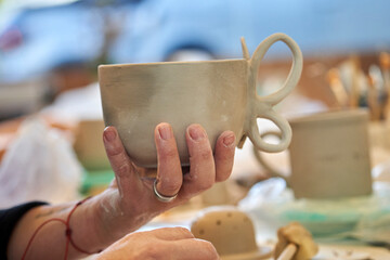 Shape clay with hands