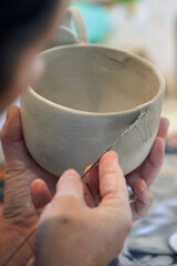 Shape clay with hands