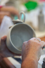 Shape clay with hands