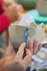 Shape clay with hands