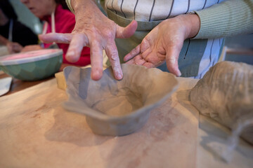 Shape clay with hands