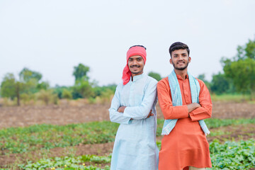 indian farmer standing together at agricultural field