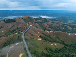 High angle view from a drone, agricultural area on the mountain that looks encroaching on the...
