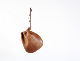 natural leather cow hide pig skin purse with draw cords  isolated on a white background