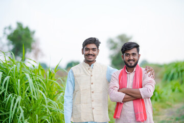 indian farmer standing together at agricultural field