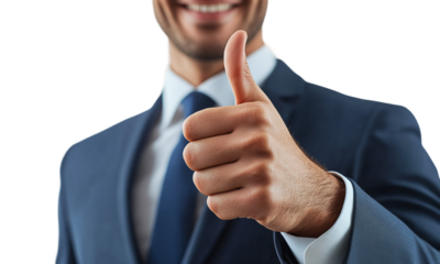 Portrait of a smiling businessman showing thumbs up, isolated on transparent background.