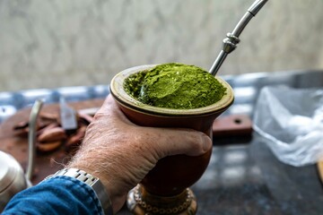 Brazilian winter tradition, yerba mate chimarrão with roasted pine nuts and bergamot